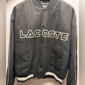 LACOSTE rare jacket, color black with white accents, sizes S-L, Run a bit loose.